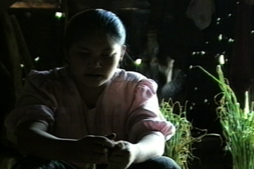 Image of woman in a kitchen looking down