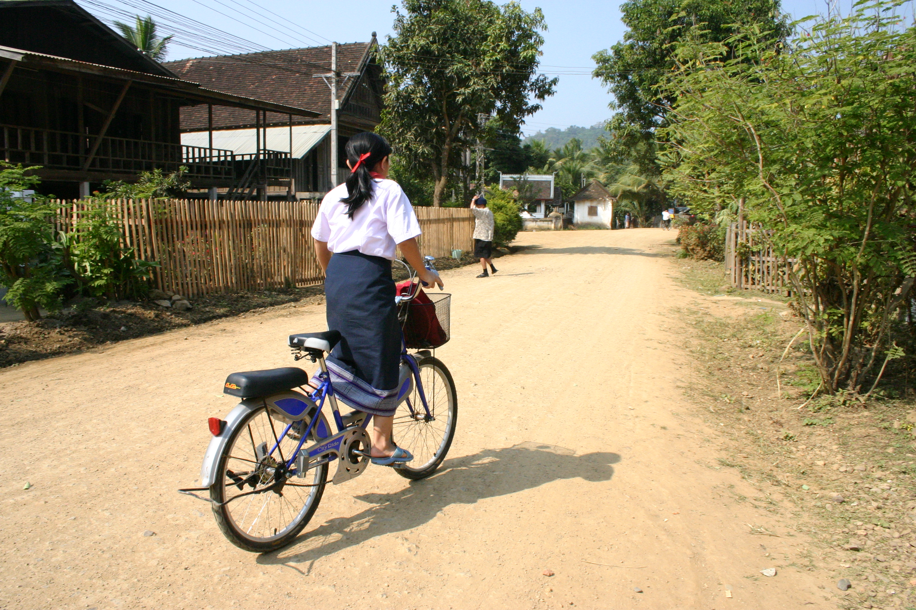 Image of Lao school girl on bicycle
