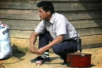 Image of a man near a detonator